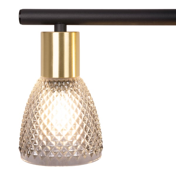 Detail einer Deckenleuchte mit Glasschirm und Metallaufhängung