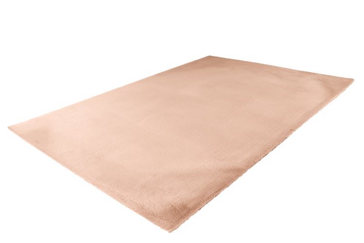 Rechteckiger, weicher Kunstfell-Teppich in Pfirsichfarben mit flauschiger Oberfläche.