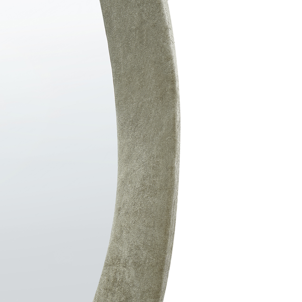 Detailansicht eines runden Spiegels mit strukturiertem Rahmen