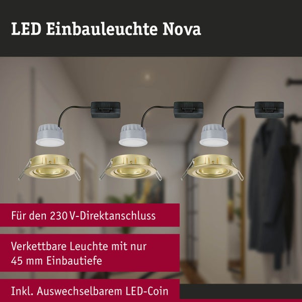 Runde LED Außenwandleuchte mit Bewegungsmelder montiert an einer Hauswand vor einer Meereslandschaft