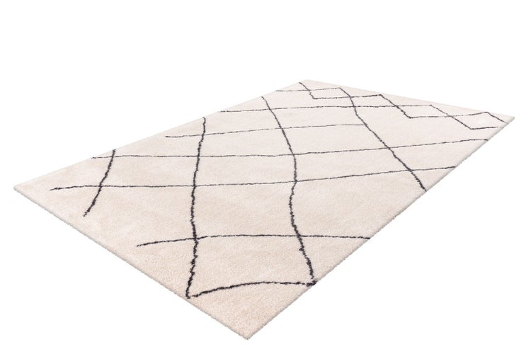 Hochflor-Teppich mit schwarzem Rautenmuster auf hellem Grund, rechteckig.