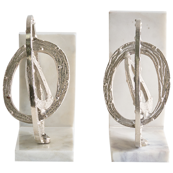 Zwei silberfarbene Buchstützen aus Marmor mit dekorativem Metallornament