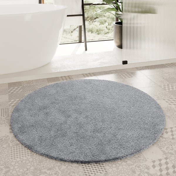 Runder Hochflor-Teppich in Grau.