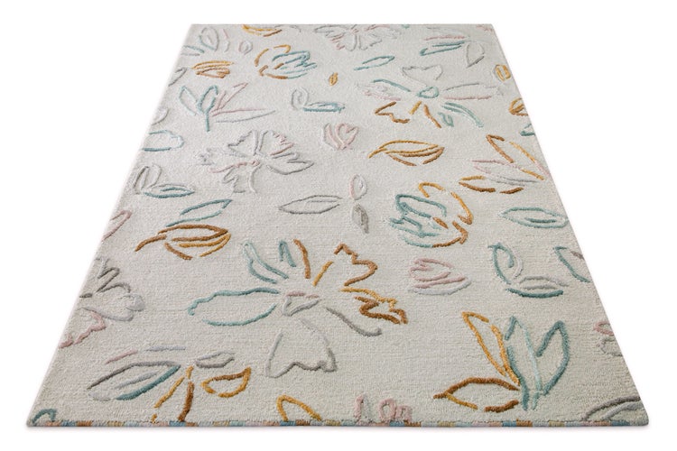 Teppich mit floralem Muster und strukturierter Oberfläche in Reliefoptik.
