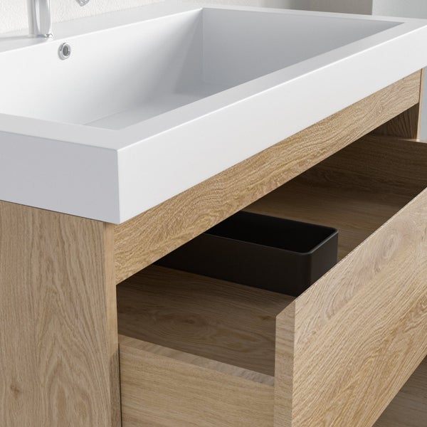 Moderner Waschtischunterschrank in Eichenoptik mit weißem Aufsatzwaschbecken und einer geöffneten Schublade inklusive schwarzem Organizer.