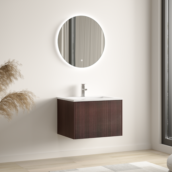 Modernes Badezimmermöbel mit rundem LED Spiegel und wandhängendem Waschtischunterschrank in Rillenoptik mit Waschbecken und Armatur.