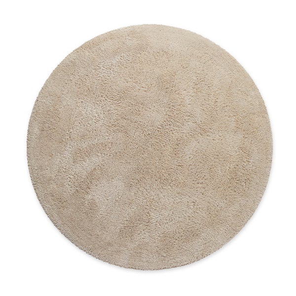 Runder Hochflor-Teppich mit weichem, dichtem Flor in Beige.