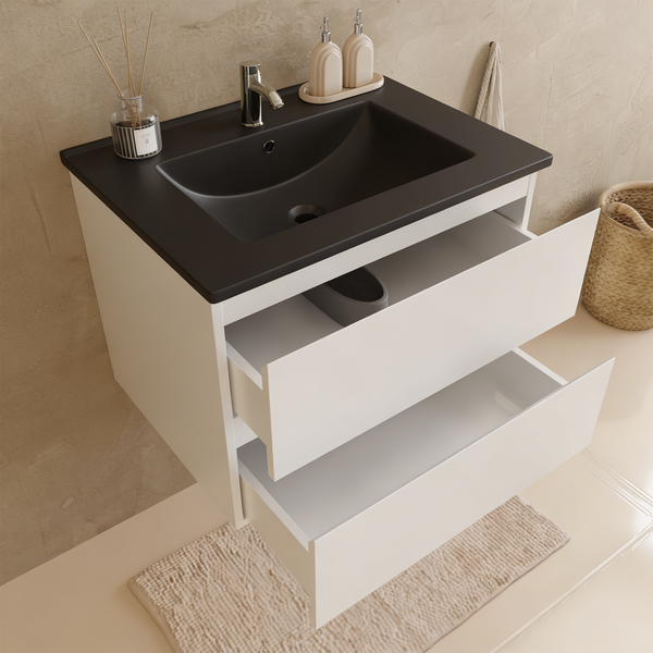 Moderner Waschtischunterschrank mit zwei Schubladen und dunklem Waschbecken in einem Badezimmer.
