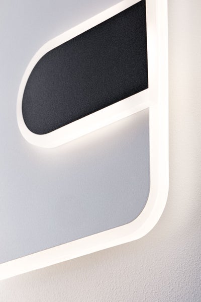 Moderne LED Wandleuchte mit indirekter Beleuchtung und abgerundeten Ecken.