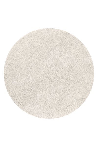 Runder Hochflor-Teppich in Cremeweiß mit weichem, zotteligem Flor.