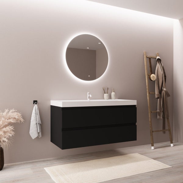 Modernes Badezimmer mit wandhängendem schwarzem Waschbeckenunterschrank, weißem Waschtisch und rundem, beleuchtetem LED-Spiegel.