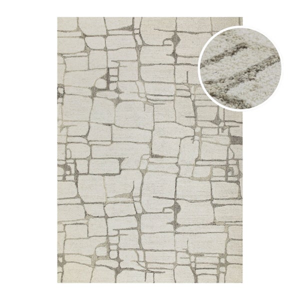 Moderner Teppich mit geometrischem Steinmuster und Detailansicht der gewebten Textur.