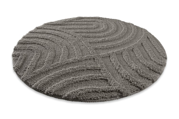 Runder grauer Badteppich mit Hoch-Tief-Struktur und Wellenmuster.