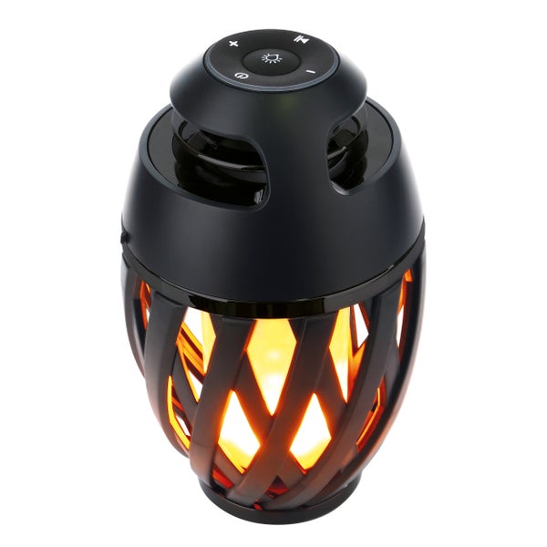 Bluetooth Lautsprecher mit Flammeneffekt auf Holztisch