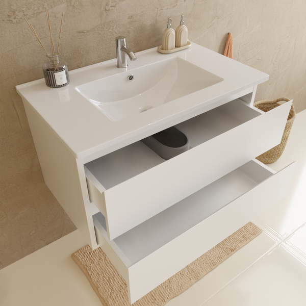 Waschtischunterschrank mit zwei Schubladen und aufgesetztem Waschbecken in modernem Design vor einer strukturierten Wand.