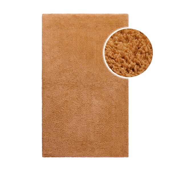 Braune Badematte mit Hochflor-Struktur und einer kreisförmigen Detailansicht der weichen Fasern.