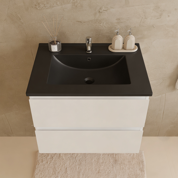 Waschtischunterschrank mit zwei Auszügen und schwarzem Waschbecken sowie Armatur in einem modernen Badezimmer.
