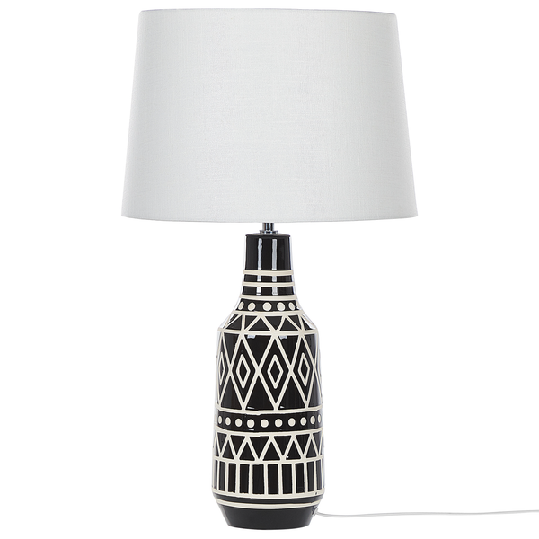 Tischleuchte mit geometrischem Muster auf dem Lampenfuß und Lampenschirm