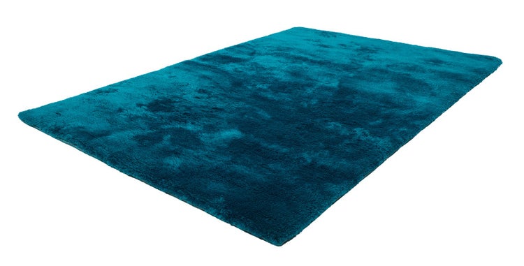 Rechteckiger Hochflor-Teppich in Petrol mit weicher Oberfläche.