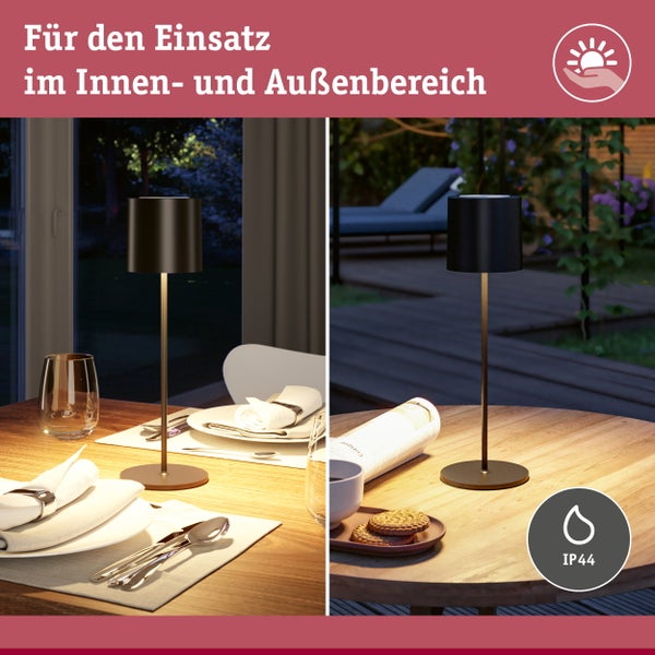 Wohnraum mit Küchenbereich und flexibler Schienenbeleuchtung