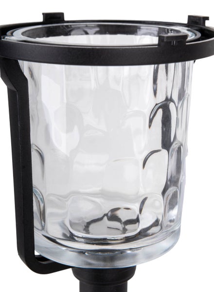 Detailaufnahme einer transparenten Glaslaterne mit schwarzem Rahmen