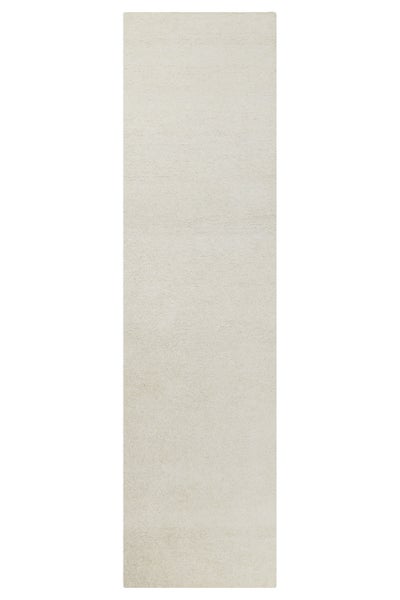 Schmaler, rechteckiger Teppichläufer mit weicher, strukturierter Oberfläche in hellem Beige.