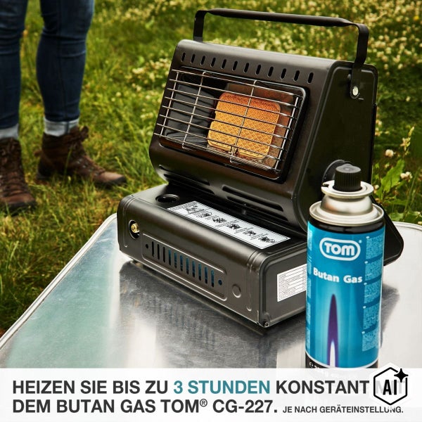 Mobiler Gasheizer mit einer Gaskartusche auf einem Tisch im Freien stehend.