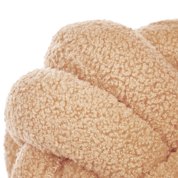 Detailansicht eines Knotenkissens aus Teddy-Fleece mit weicher, strukturierter Oberfläche.