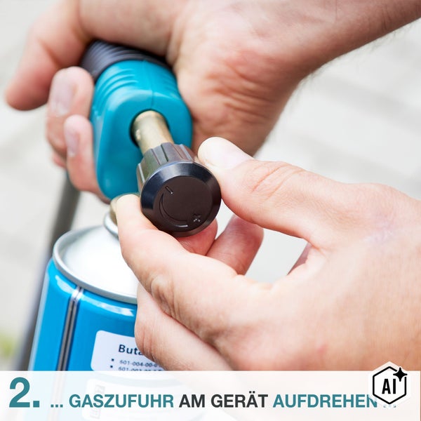 Hände bedienen das Drehventil an einer Gaskartusche eines Gasbrenners zum Aufdrehen der Gaszufuhr