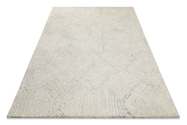 Webteppich in Creme mit strukturierter Oberfläche und geometrischem Rautenmuster.