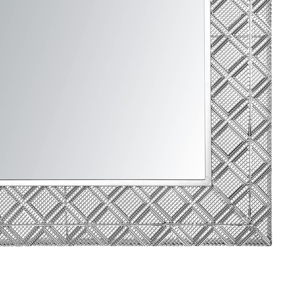 Detailaufnahme eines Spiegels mit gemustertem Rahmen