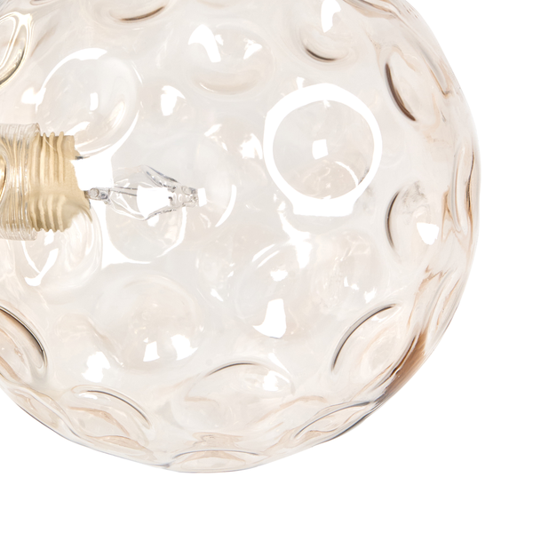 Nahaufnahme einer transparenten Glühbirne mit dezentem Muster für eine stimmungsvolle Beleuchtung