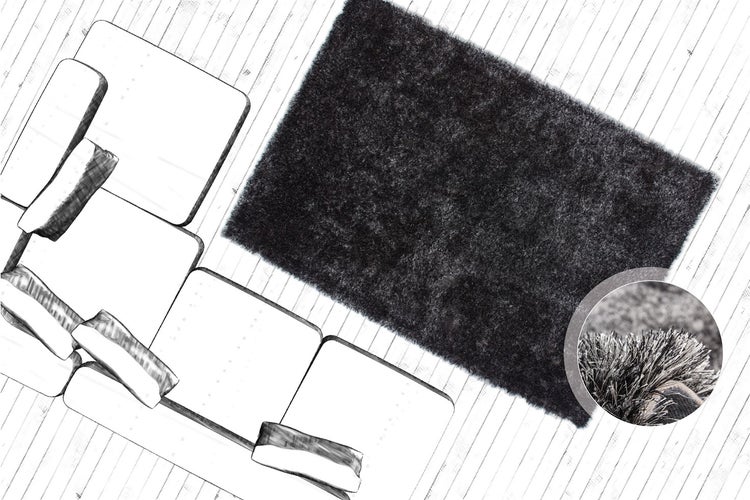 Rechteckiger Hochflor-Teppich Shaggy in einem Wohnzimmer neben einem Sofa auf Holzboden, mit Detailansicht der weichen Materialstruktur.