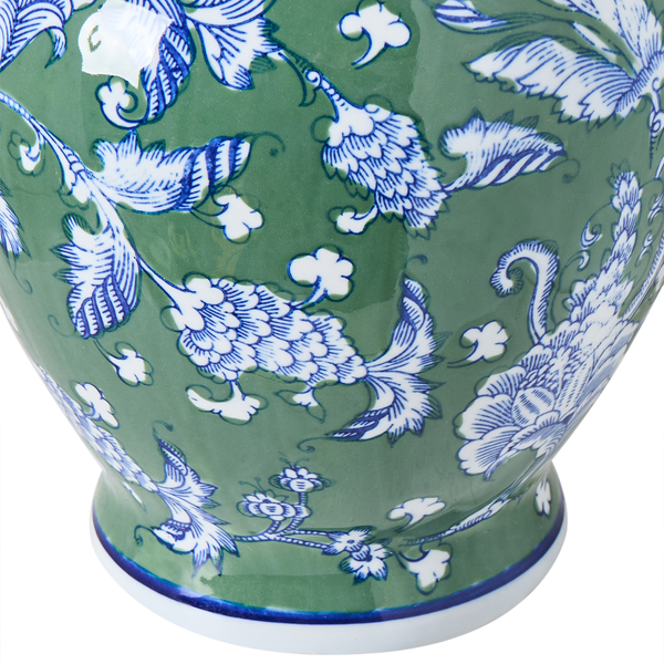 Dekorative grüne Vase mit floralem Design