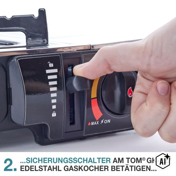 Hand bedient den Sicherungsschalter am Tom GK 227 Edelstahl Gaskocher zur Verriegelung der Gaskartusche.