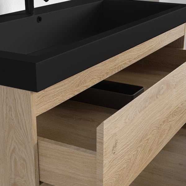 Moderner Waschtischunterschrank in Eichenoptik mit schwarzem Waschbecken und geöffneter Schublade.