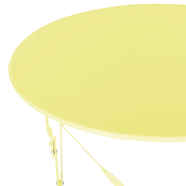 Detailansicht einer runden Tischplatte mit Metallbeinen.