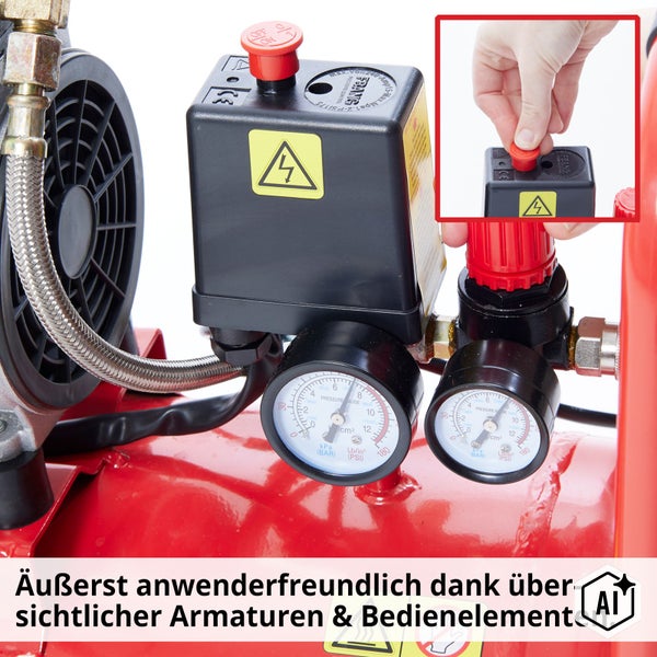 Druckschalter und Manometer an einem Kompressor mit rotem Ein- und Ausschalter und einer Hand zur Bedienung.