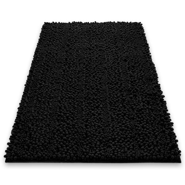 Schwarze Badematte aus Chenille mit Noppenstruktur.