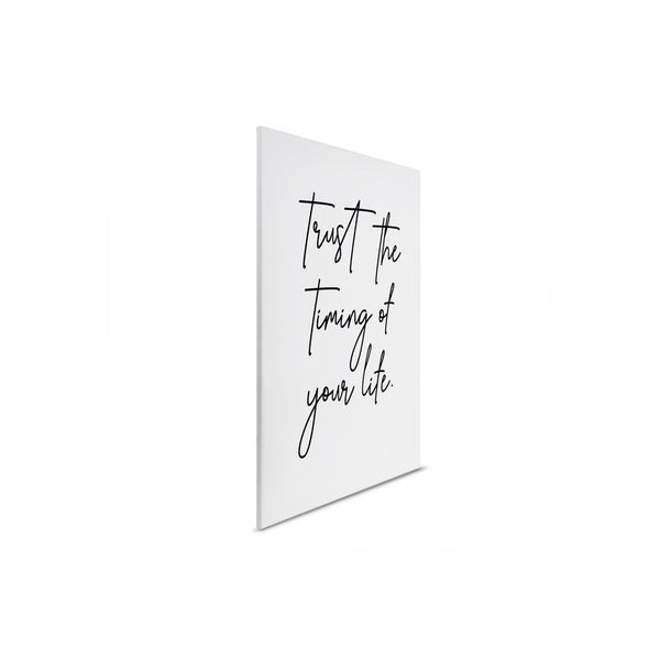 Dekorative Leinwand mit dem Schriftzug Vertraue dem Timing deines Lebens