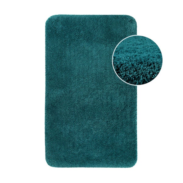 Badematte in Petrol, rechteckig mit abgerundeten Ecken, weiches Hochflor-Material mit Detailansicht der Struktur.