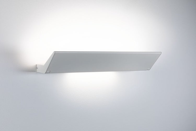 Moderne LED Wandleuchte in flacher Bauform zur indirekten Beleuchtung montiert an einer Wand.