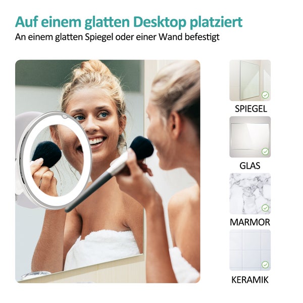 Frau vor einem Spiegel mit LED-Beleuchtung beim Schminken