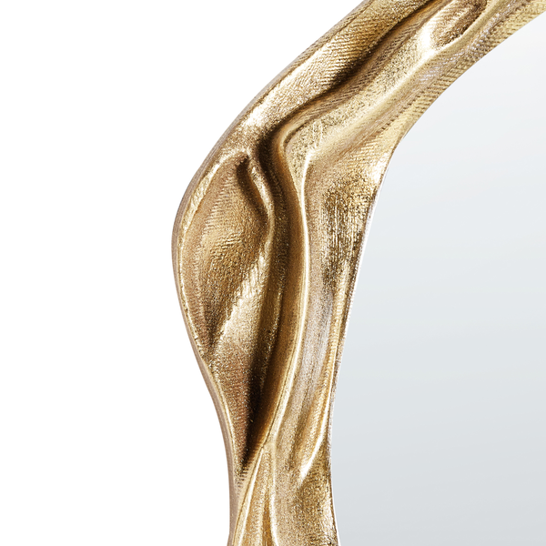 Nahaufnahme eines strukturierten goldfarbenen Rahmens mit wellenförmigem Design.