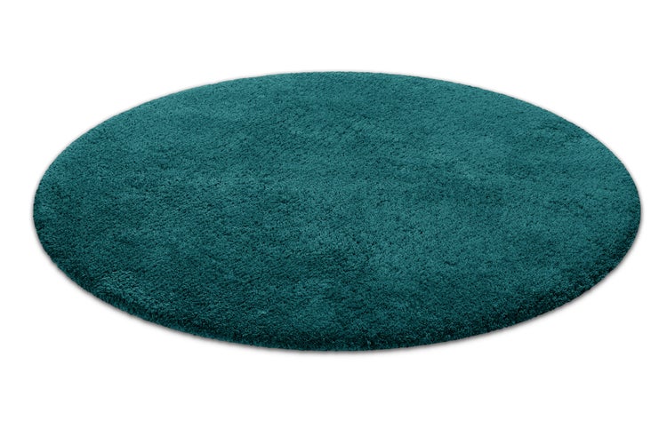 Runder Hochflor-Teppich in Petrolblau mit weicher Oberflächenstruktur.