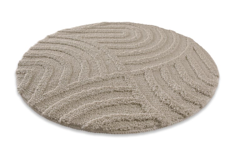 Runder Badeteppich mit Wellenstruktur und weicher Oberfläche.