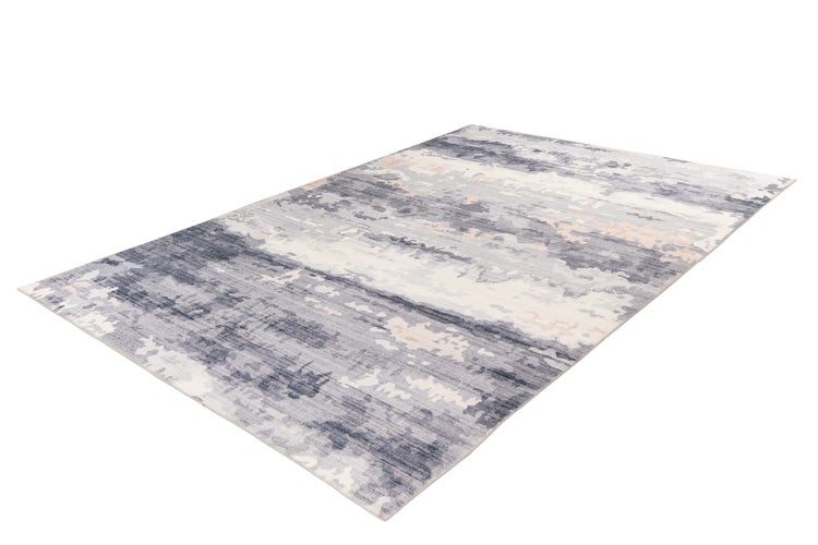 Rechteckiger Kurzflorteppich mit abstraktem, marmoriertem Muster in Grau, Blau und hellen Tönen.