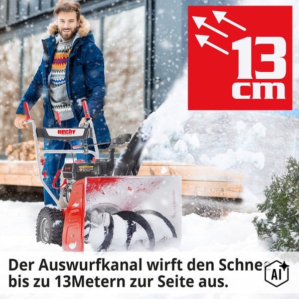 Ein Mann bedient eine Hecht Schneefräse, deren Auswurfkanal den Schnee bis zu 13 Meter weit auswirft.