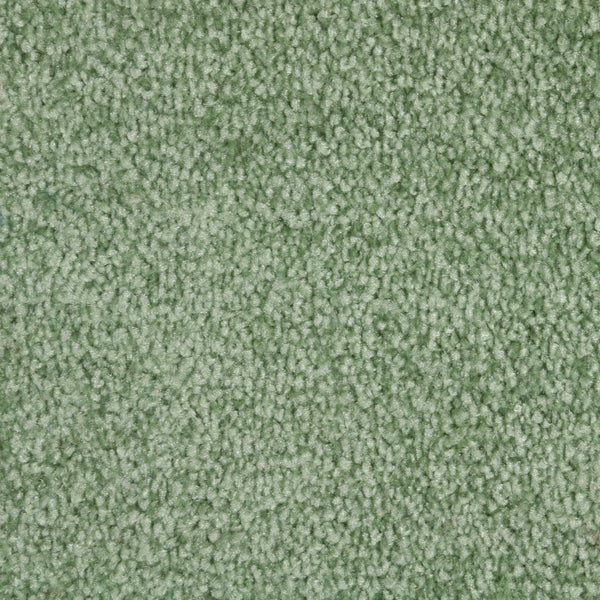 Strukturierter grüner Teppichboden aus Textilmaterial.