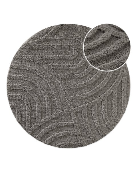 Runder Badeteppich mit strukturierter Oberfläche und Nahaufnahme der Textur.